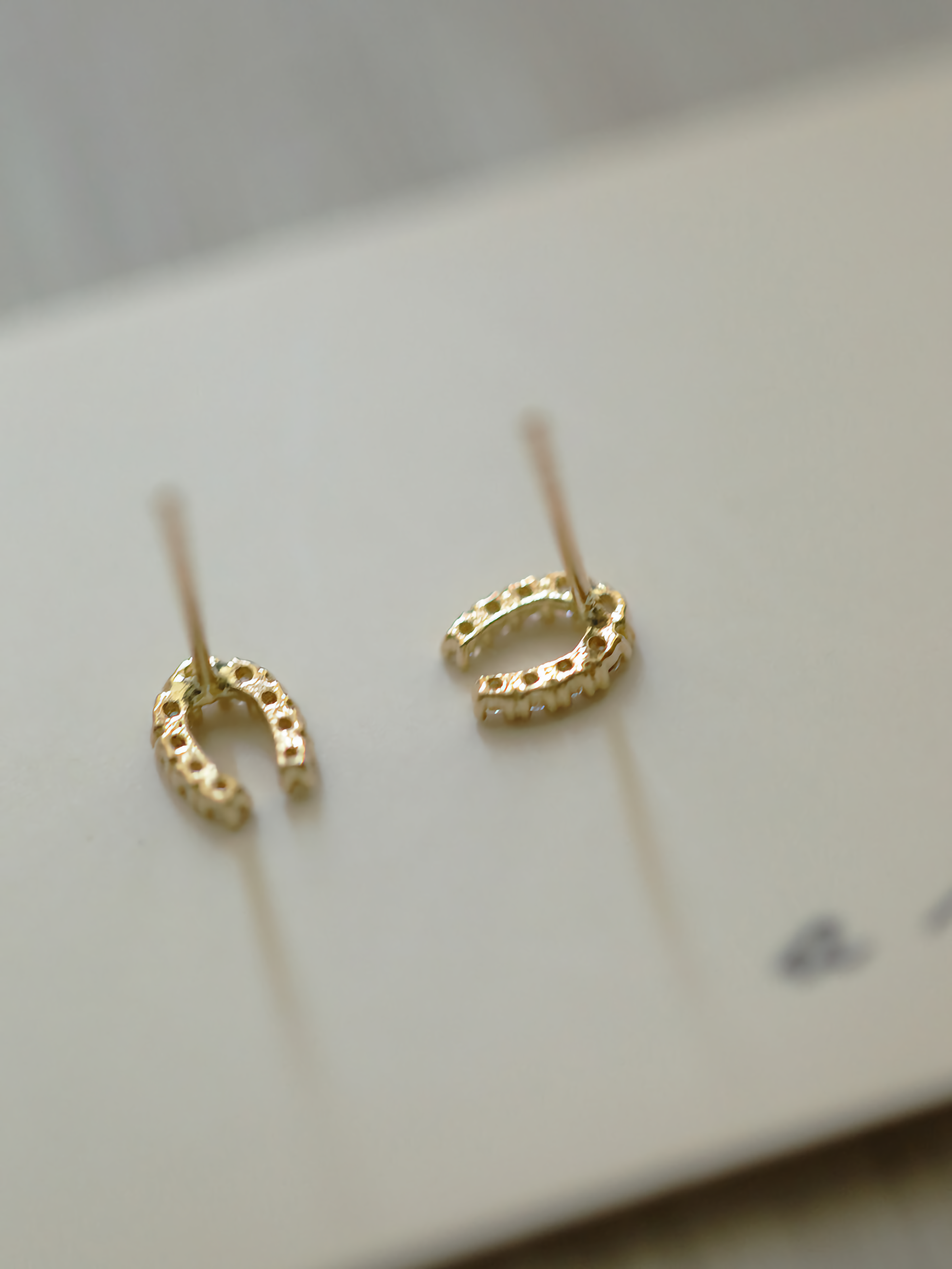 9ct solid gold studs designed as horseshoes, a chic embodiment of luck and style in jewelry form.