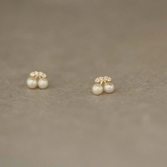 9ct solid gold cherry studs with embedded pearls, adding a touch of elegance to any ensemble.