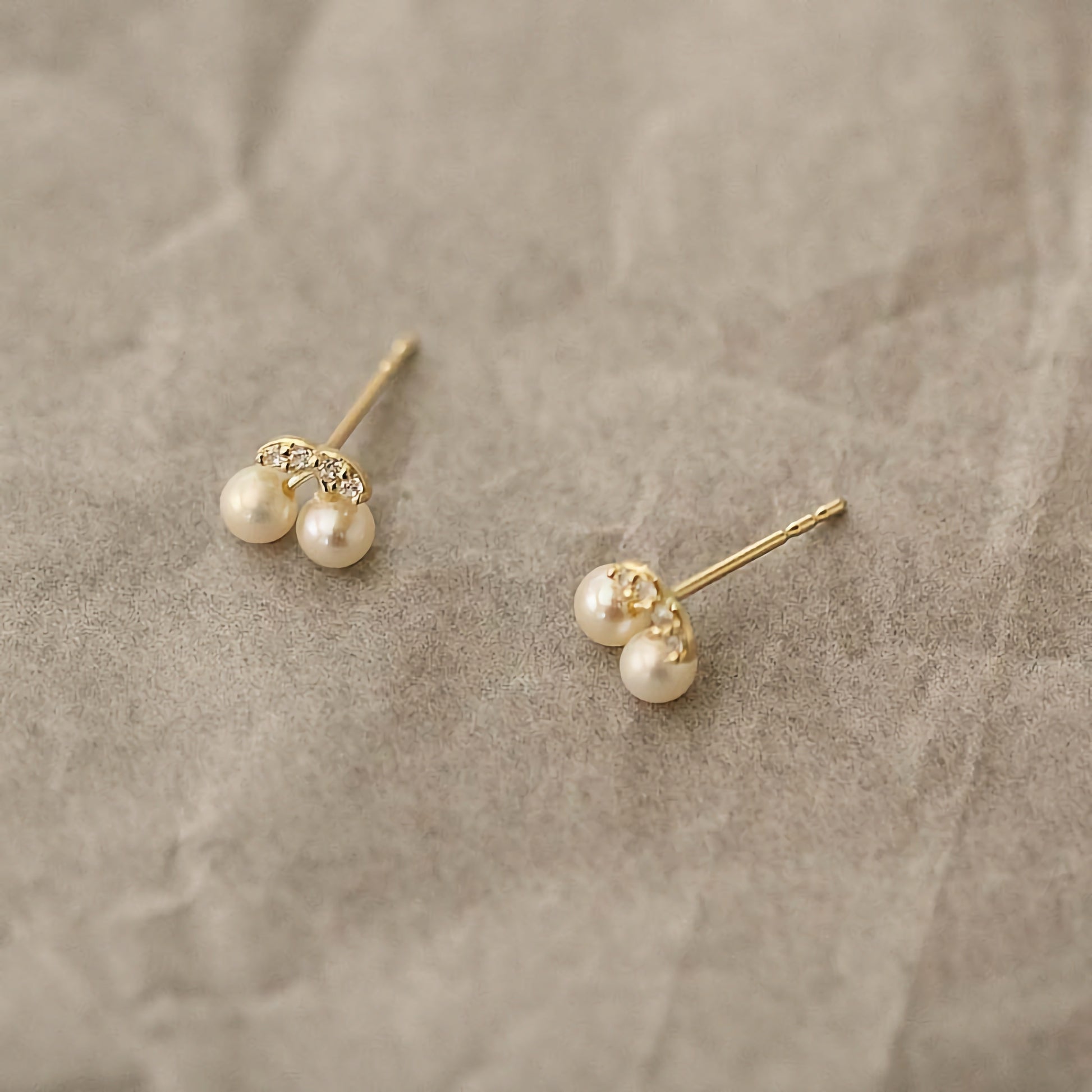 Handmade 9ct solid gold studs, creatively designed as cherries and adorned with lustrous pearls.