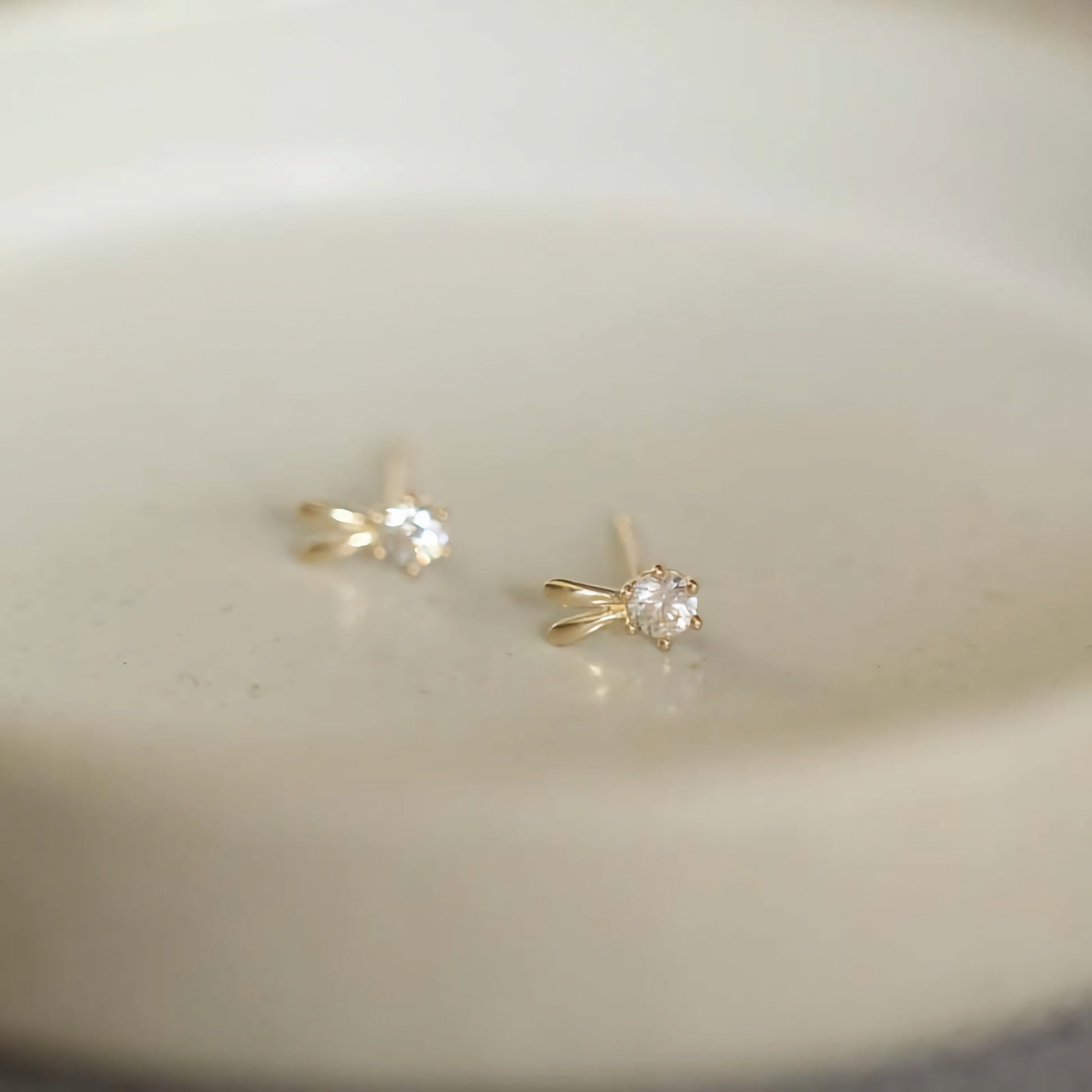 Close-up image of 9ct solid gold bunny ears studs, meticulously handcrafted for a playful aesthetic.