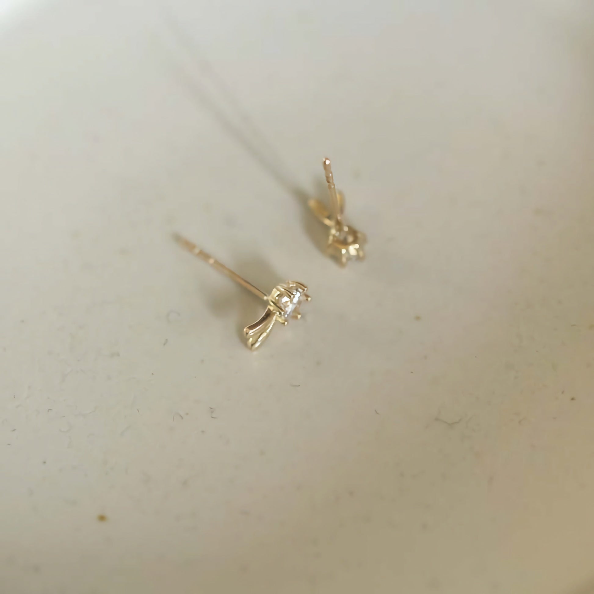 Handmade 9ct solid gold studs in the shape of playful bunny ears, an elegant yet quirky addition to any jewelry collection.