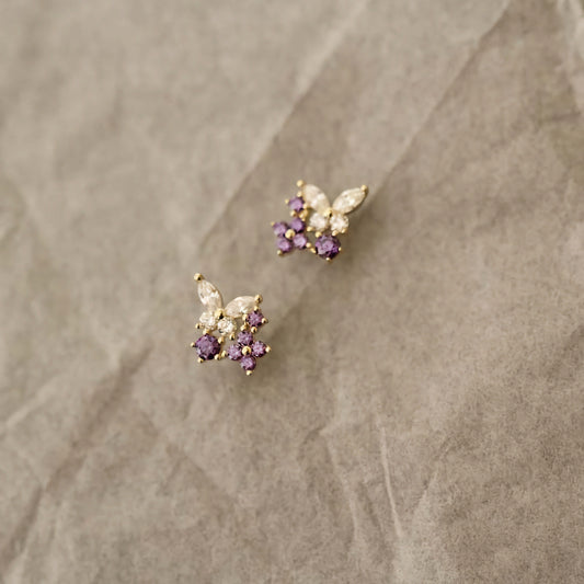 9ct solid gold studs shaped as delicate butterflies, adorned with lavender gemstones for an enchanting look.