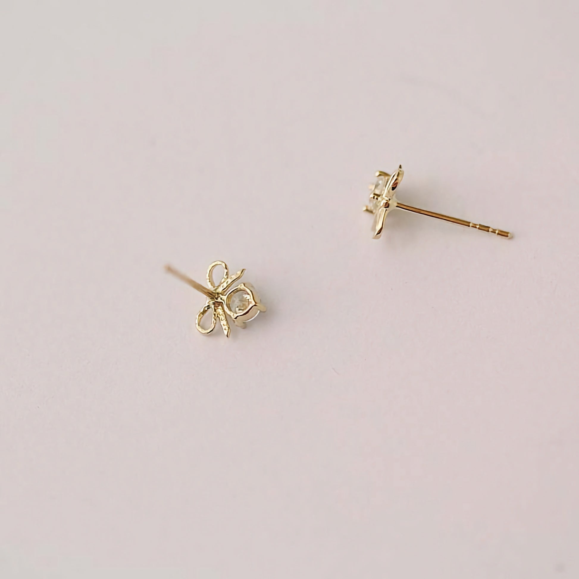 Elevate your style with 9ct Solid Gold Bowtie Hearts Earrings - A timeless and versatile accessory that adds a touch of sophistication to any look.